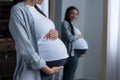 african american pregnant woman looking at her belly Royalty Free Stock Photo