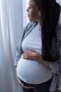 african american pregnant woman touching her belly while looking Royalty Free Stock Photo