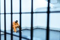african american prisoner sitting on bench behind Royalty Free Stock Photo