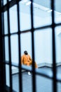 african american prisoner sitting on bench Royalty Free Stock Photo