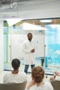 African American Professor Giving Presentation at Medical Seminar Royalty Free Stock Photo