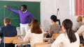 African american professor lecturing to adult students at university
