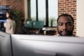 African american programmer developing high security application with multiple layers of scalability.