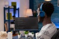 African american programmer with headset programming website code Royalty Free Stock Photo