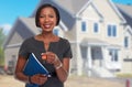 African-American realtor woman with key. Royalty Free Stock Photo