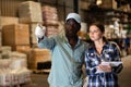 African American salesman helping customer choose materials