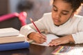 African american schoolgirl doing homework Royalty Free Stock Photo