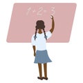 African American schoolgirl writes on a blackboard with chalk and solves a mathematical example Royalty Free Stock Photo