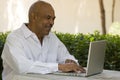 African American senior citizen working on laptop computer Royalty Free Stock Photo