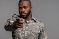 African American serviceman pointing forward with his forefinger Royalty Free Stock Photo