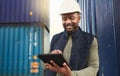 African american shipyard worker, shipping logistics and transportation of international commercial goods. Tablet for