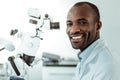 African American short-haired beaming doctor openly smiling