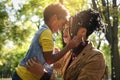 African American single mother in park with her daughter.