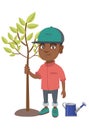 African-american smiling boy planting a tree. Royalty Free Stock Photo