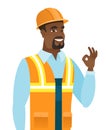 African-american smiling builder showing ok sign.