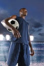 African American Soccer Player Holding Ball