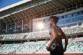 African-American soccer player on training drill. Legs of footballer running on grass practice field Royalty Free Stock Photo