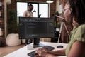 African american software developer debugging source code algorithm looking at computer screen