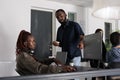 African american software developers discussing about coding script Royalty Free Stock Photo
