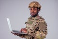 African American soldier smiles while typing a computer videocall with wife and child Royalty Free Stock Photo