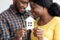 African American Spouses Holding Cutout Paper House Figure In Hands Royalty Free Stock Photo