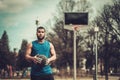 African-american streetball player practicing outdoors