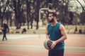 African-american streetball player practicing outdoors