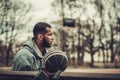 African-american streetball player resting outdoors