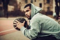 African-american streetball player resting outdoors