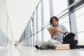 African american student with notebook in corridor in university Royalty Free Stock Photo