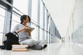 African american student with notebook in corridor in university Royalty Free Stock Photo