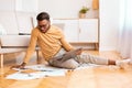 African American Student Using Laptop Sitting On Floor At Home Royalty Free Stock Photo