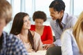 African American teacher helping student in class