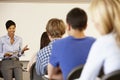 African American teacher teaching at front of class Royalty Free Stock Photo