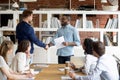 Team leader handshake make employee greeting with success Royalty Free Stock Photo