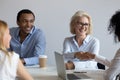 African American team leader shaking hand of mature subordinate Royalty Free Stock Photo