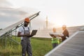 African american technician using laptop at solar station Royalty Free Stock Photo