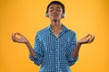 African American teen in headphones meditates