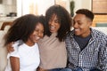 African American teen and young adult brother and sisters relaxing together, close up