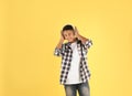 African-American teenage boy listening to music with headphones Royalty Free Stock Photo