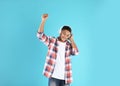 African-American teenage boy listening to music with headphones Royalty Free Stock Photo