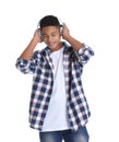 African-American teenage boy listening to music with headphones on white Royalty Free Stock Photo