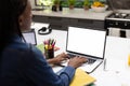 African american teenage girl studying online over laptop on table at home, copy space Royalty Free Stock Photo