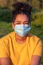 African American Teenager Girl Woman Wearing Coronavirus COVID-19 Face Mask Royalty Free Stock Photo