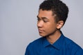 African American teenager in shirt is in turmoil. Royalty Free Stock Photo