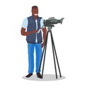 African american television operator using video camera on tripod happy cameraman looking through camcorder movie making