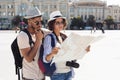 African-american tourists lost and looking for their location Royalty Free Stock Photo