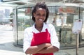 African american waitress in front of the restaurant Royalty Free Stock Photo