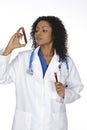 African American woman laboratory technician examining a tube of blood