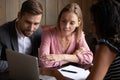 African American woman advisor consulting young couple at meeting Royalty Free Stock Photo